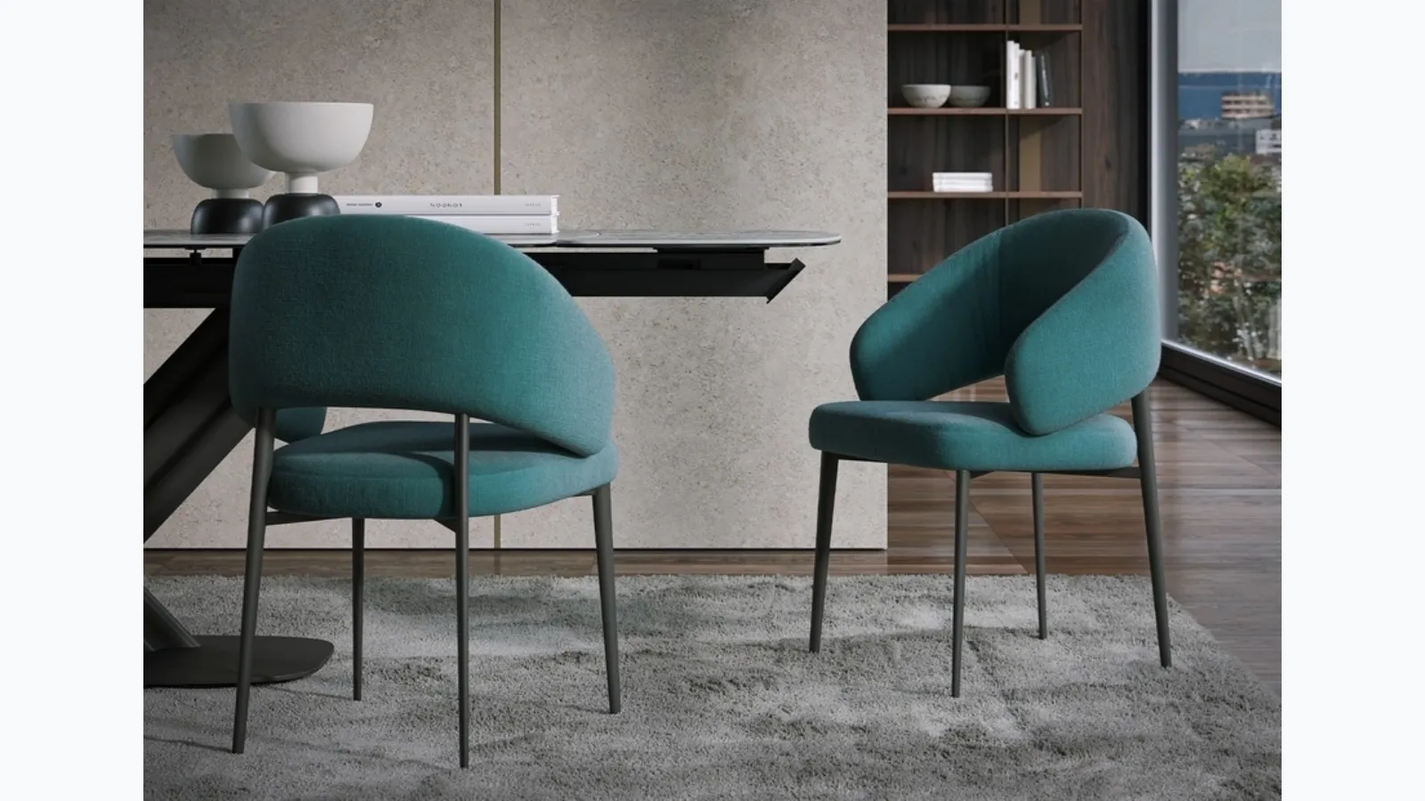 Astra chair upholstered in fabric by Tonin Casa.