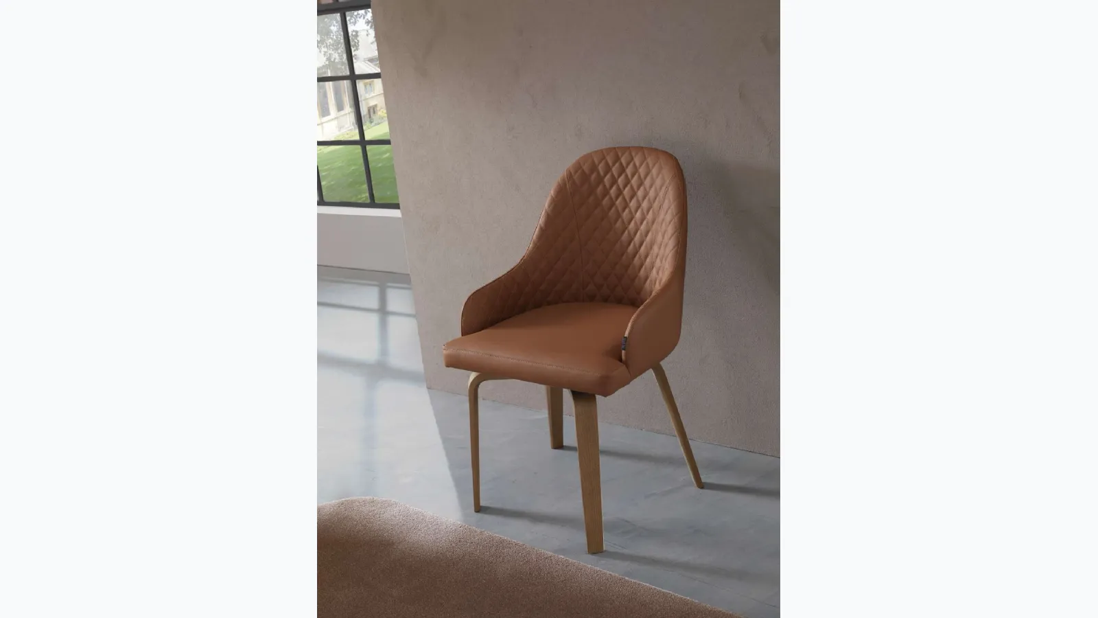 Athena chair in leather with wooden legs by Ozzio