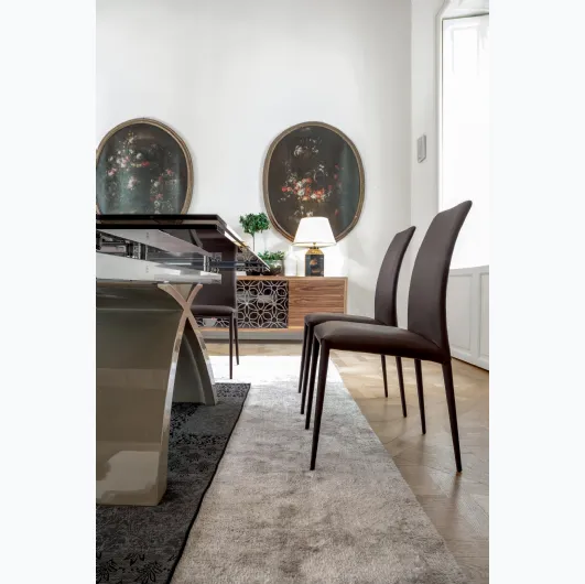 Charm chair completely covered in leather by Tonin Casa.