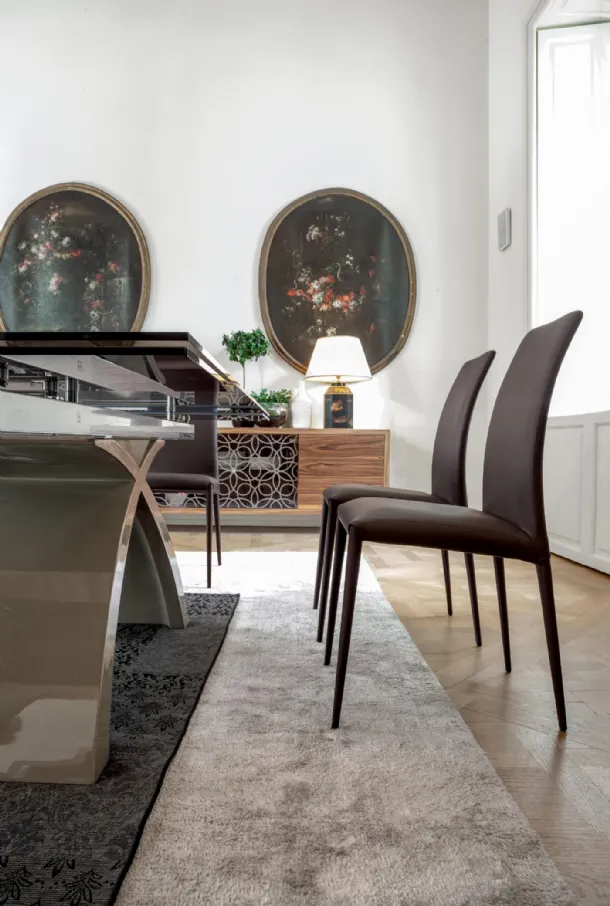 Charm chair completely covered in leather by Tonin Casa.