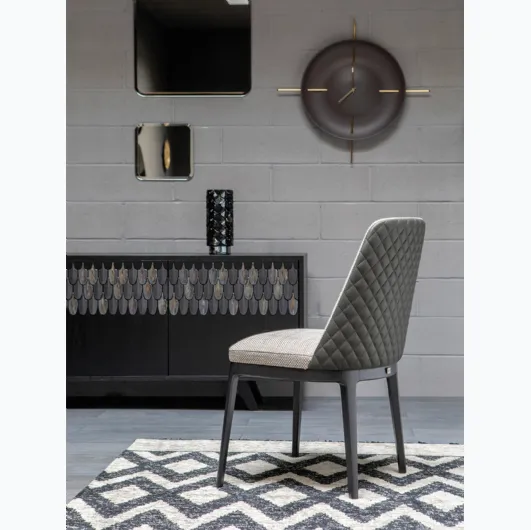 Cleo Élite chair in fabric and quilted leather by Tonin Casa.