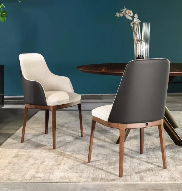 Chair with and without armrests Cleo in fabric with leather back by Tonin Casa.