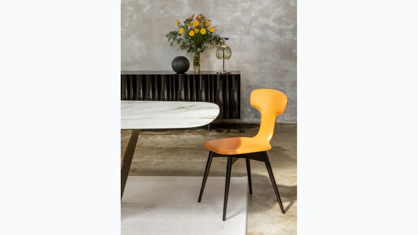 Leather Dauphine chair by Tonin Casa.