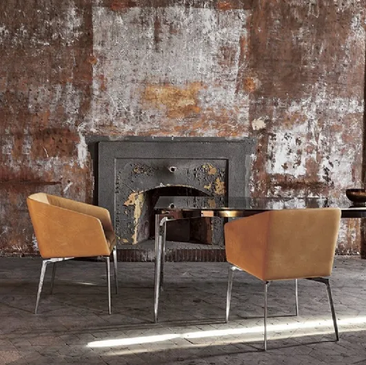 Fixed chair with chromed aluminum legs and Denise leather seat by Alivar.