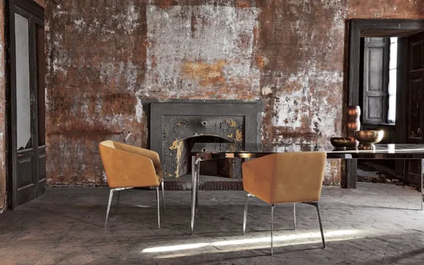 Fixed chair with chromed aluminum legs and Denise leather seat by Alivar.