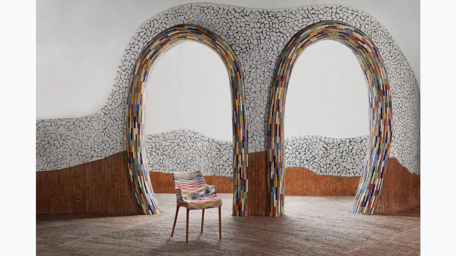 Elegance chair Nia by Kartell, made of plastic covered in fabric with armrests.