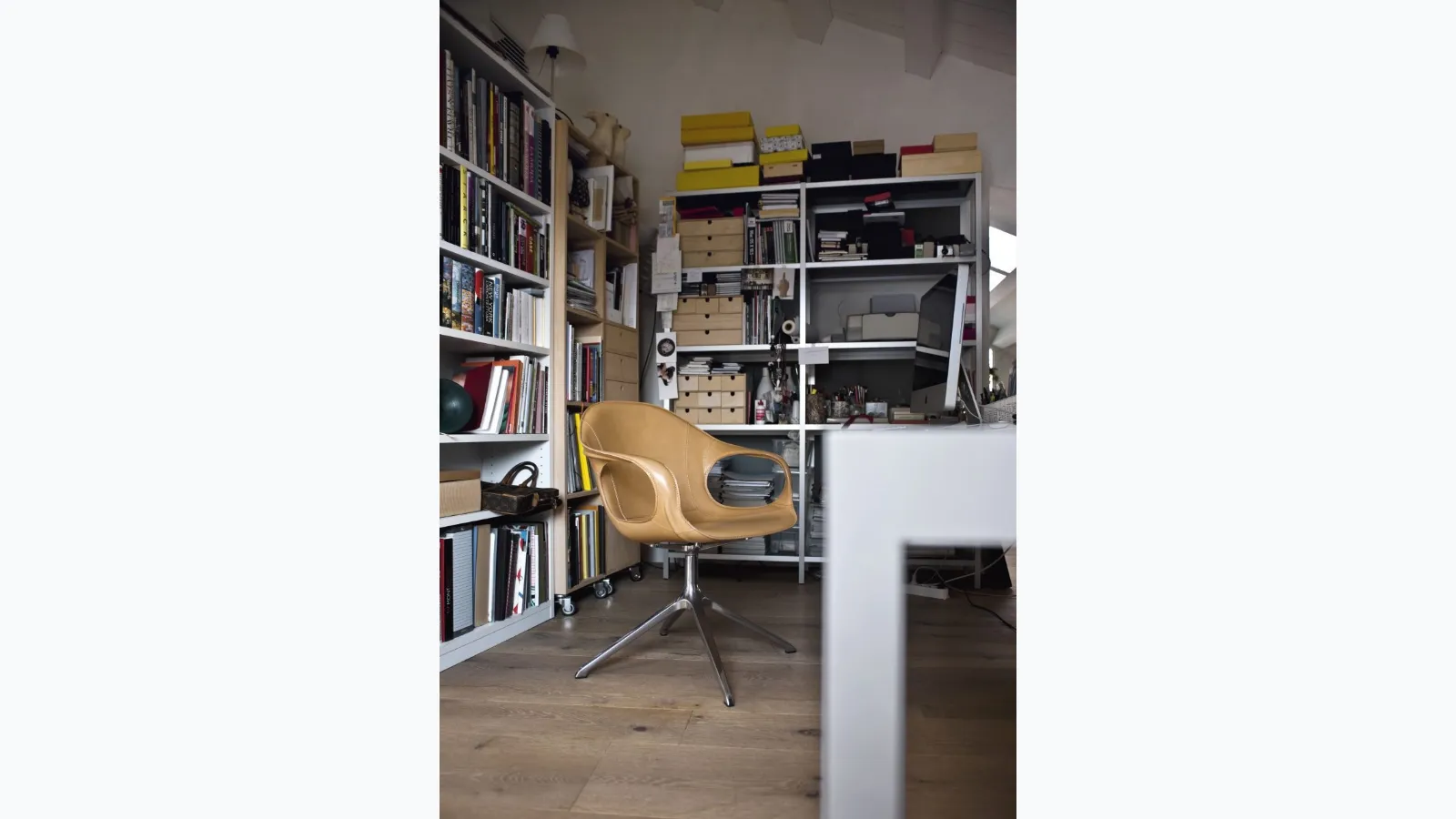 Elephant Chair with leather seat and swivel metal base by Kristalia.