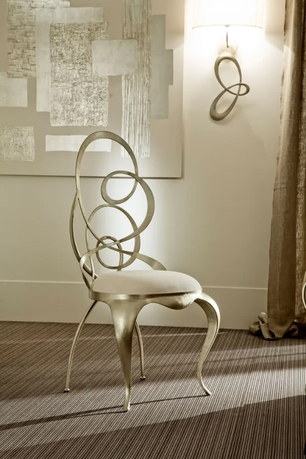 Ghirigori designer chair with iron frame and Cantori upholstered seat.