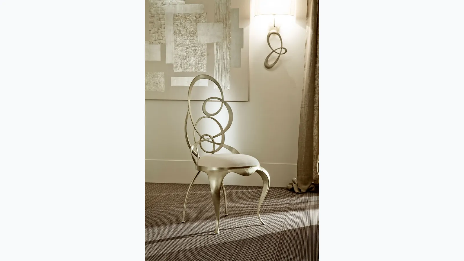 Ghirigori designer chair with iron frame and Cantori upholstered seat.