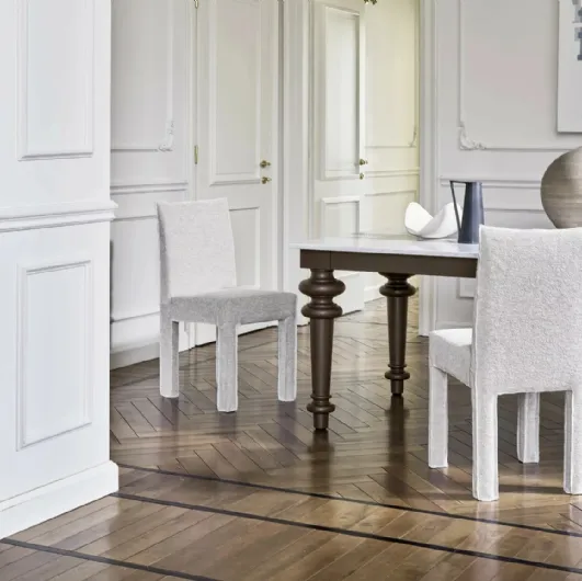 Chair upholstered in Ghost fabric by Gervasoni.