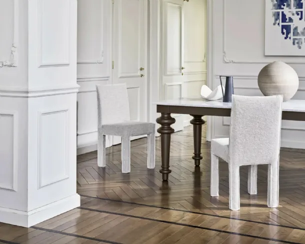 Chair upholstered in Ghost fabric by Gervasoni.