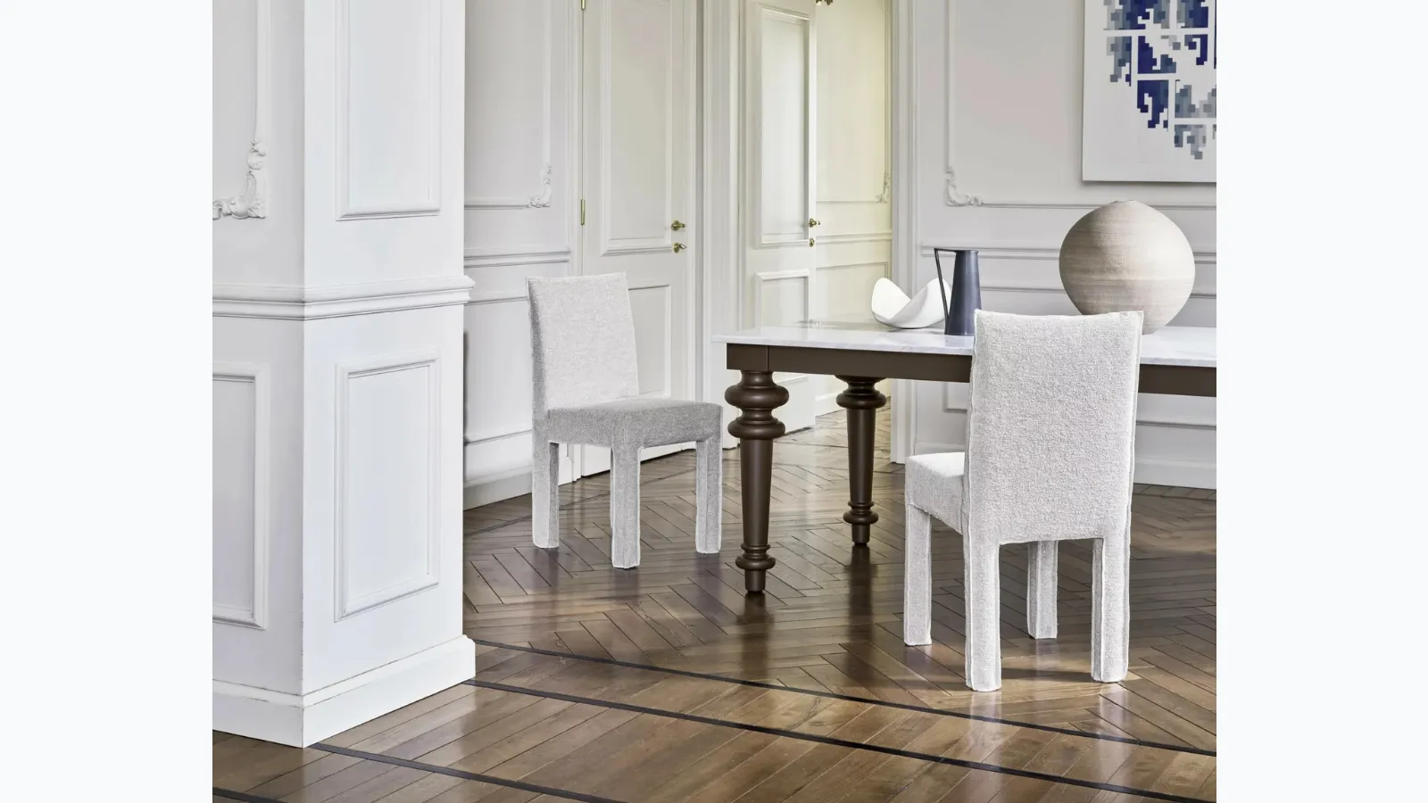 Chair upholstered in Ghost fabric by Gervasoni.