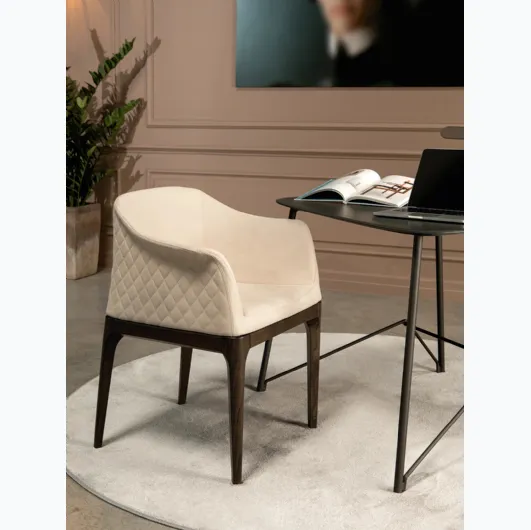 Quilted diamond pattern leather armchair with armrests on the backrest Gilda Elite by Tonin Casa.