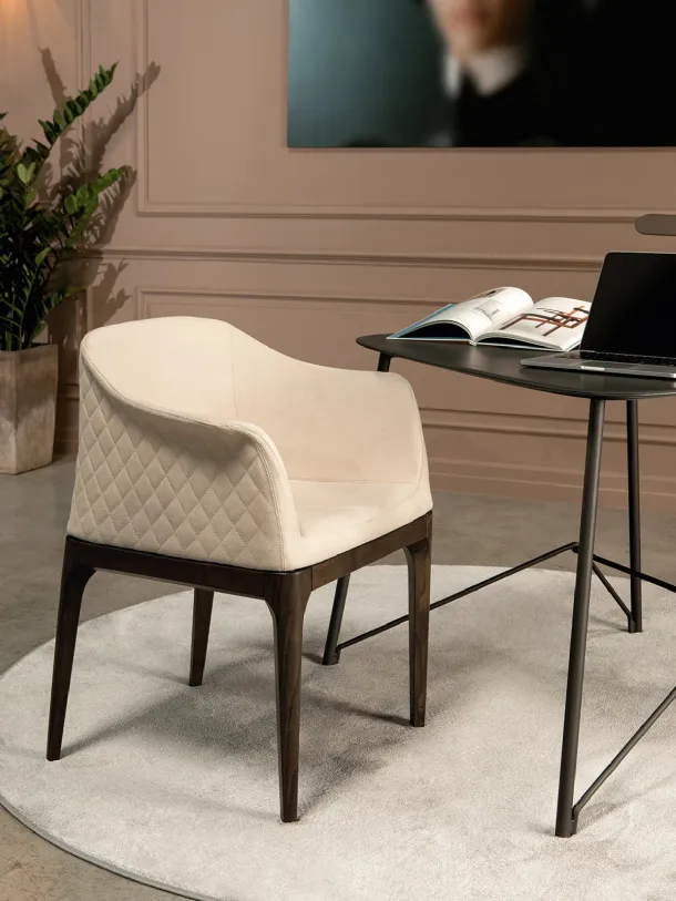 Quilted diamond pattern leather armchair with armrests on the backrest Gilda Elite by Tonin Casa.