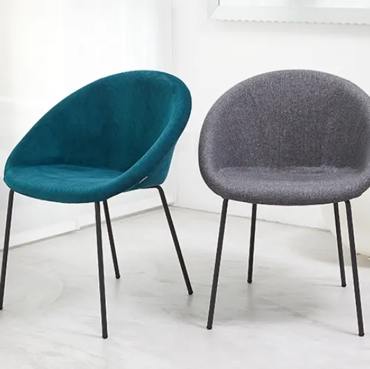 Julia Pop chair with padded fabric seat and tubular steel legs by Scab Design.