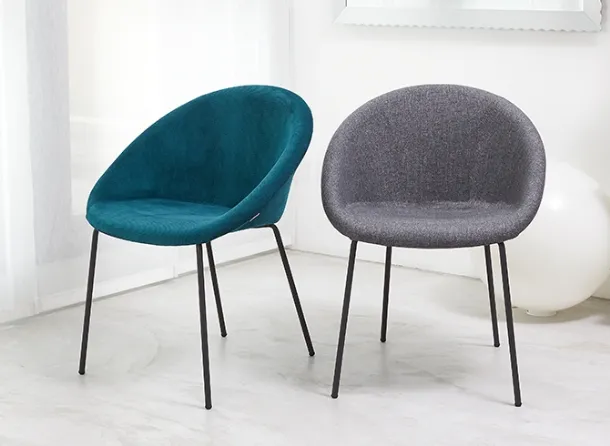 Julia Pop chair with padded fabric seat and tubular steel legs by Scab Design.