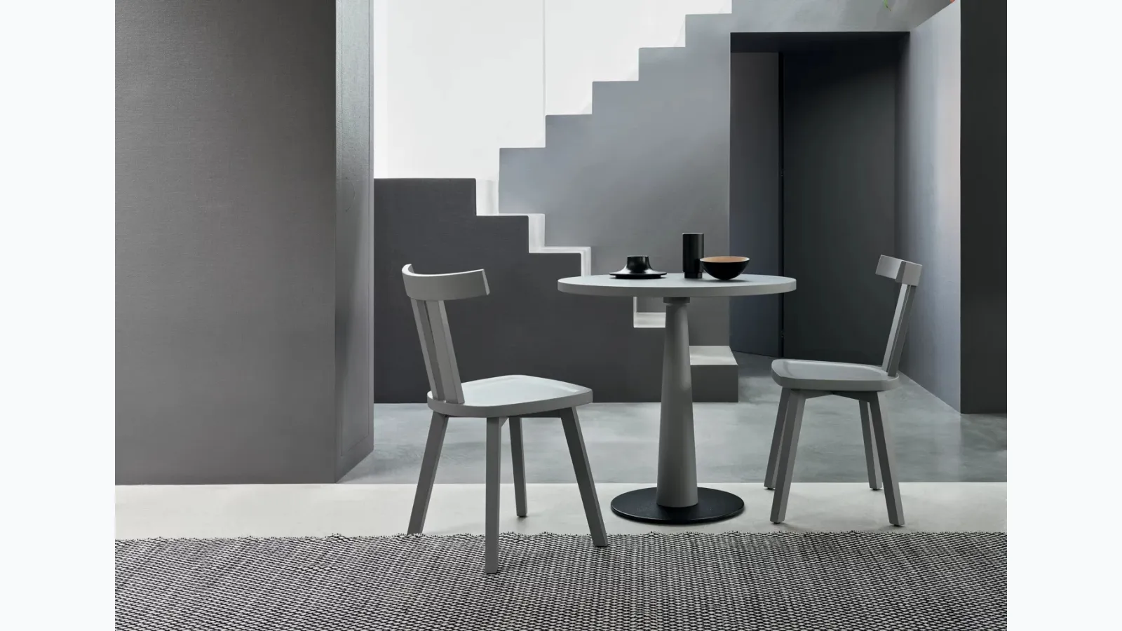 Gray wooden chair by Gervasoni.