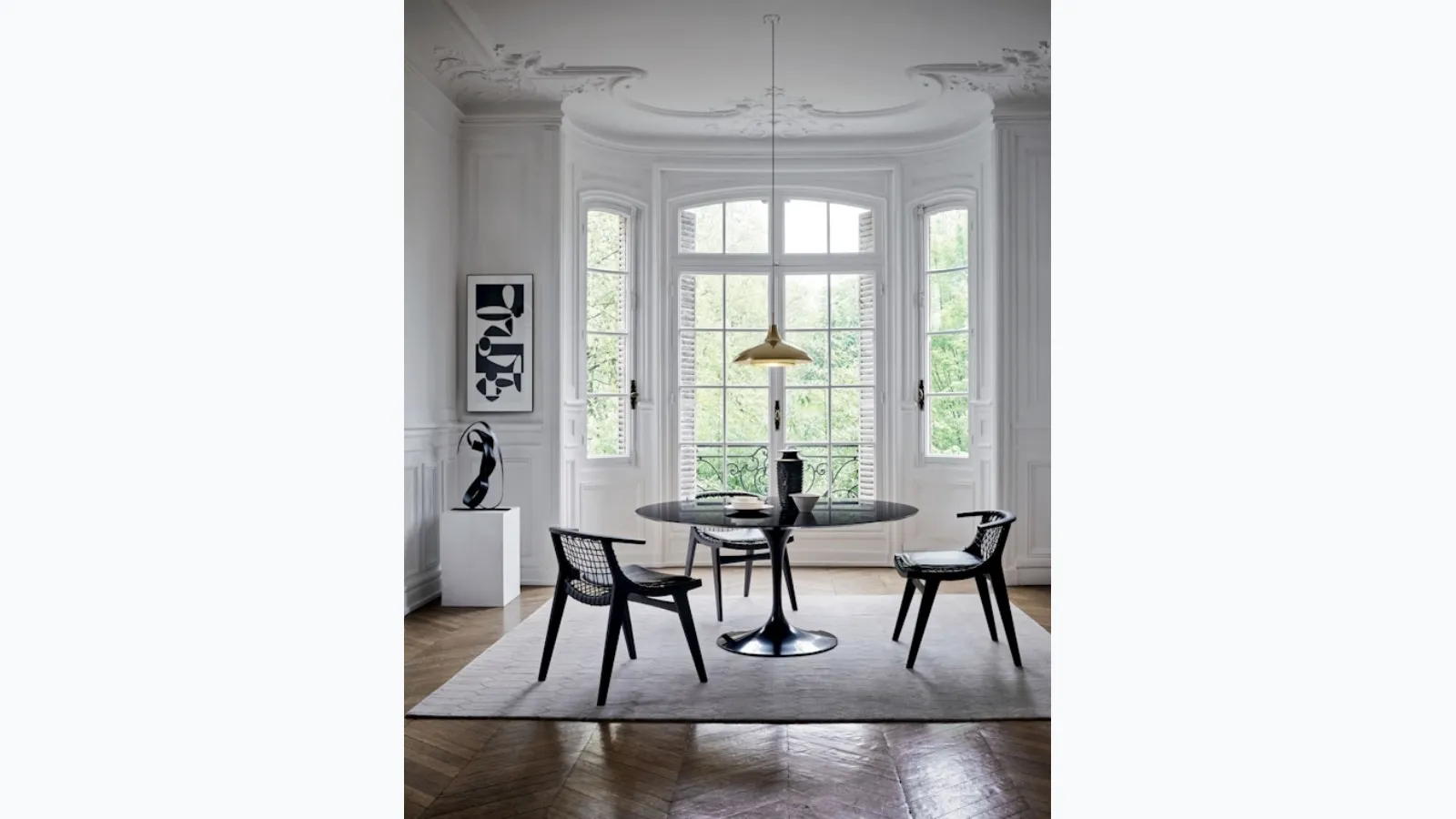 The Klismos® Dining Armchair by Knoll.