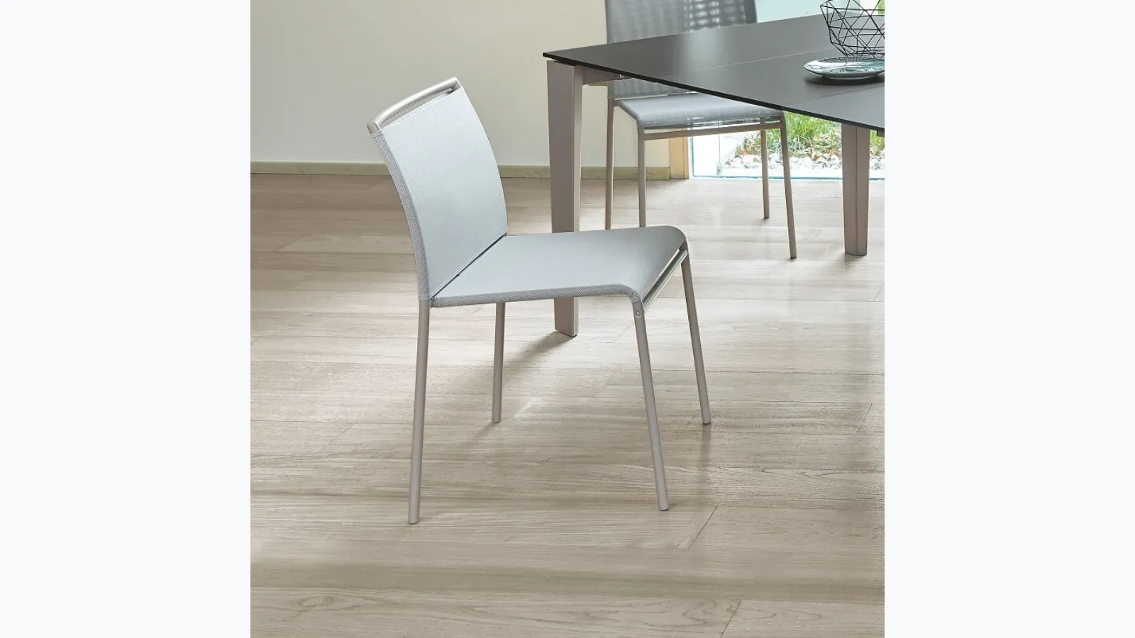 Lola chair upholstered in texplast with a metal frame by Ingenia.