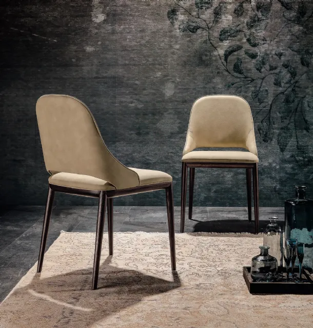 Malva chair with seat covered in Tonin Casa leather.