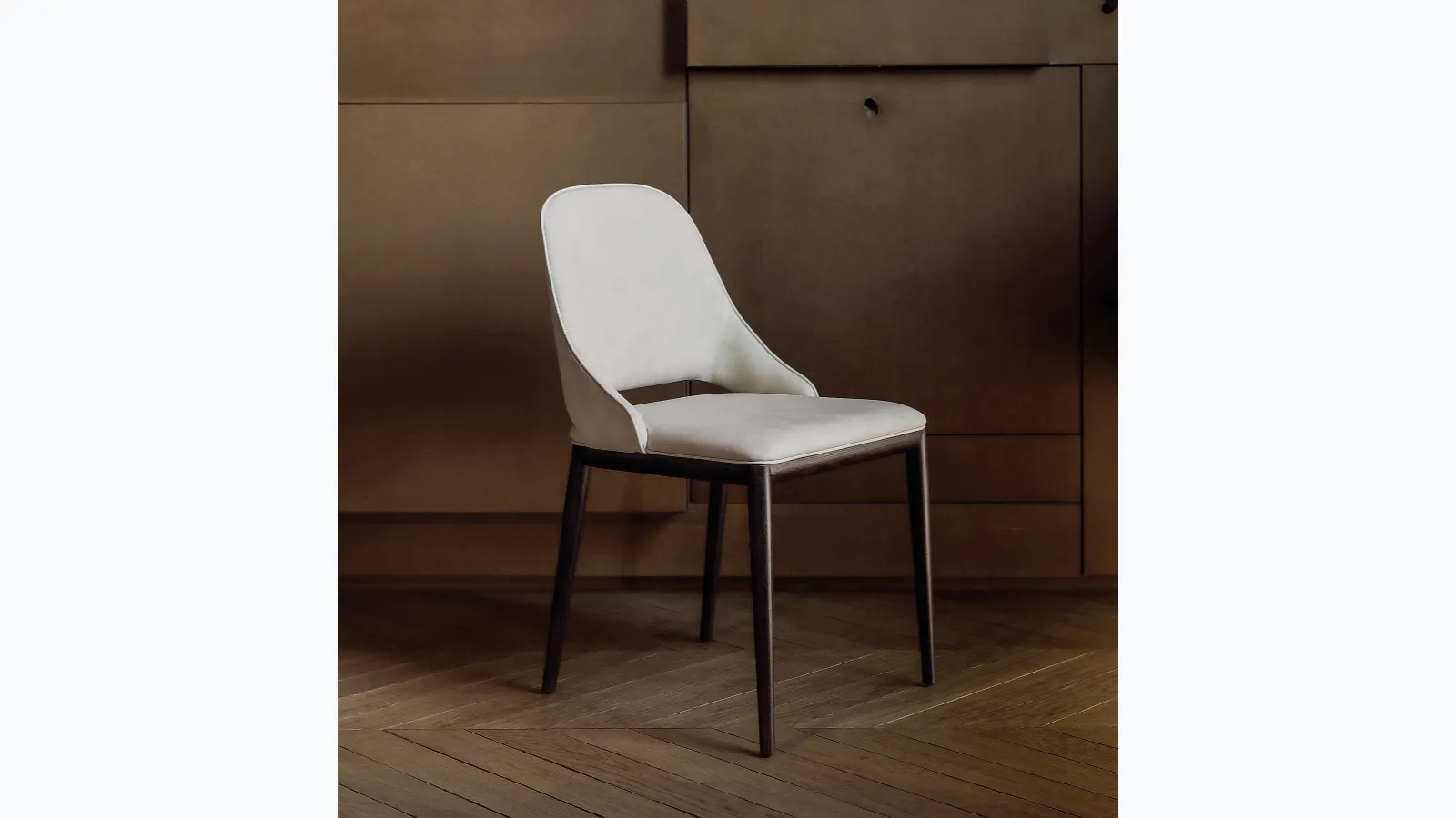 Malva chair with seat covered in leather by Tonin Casa.