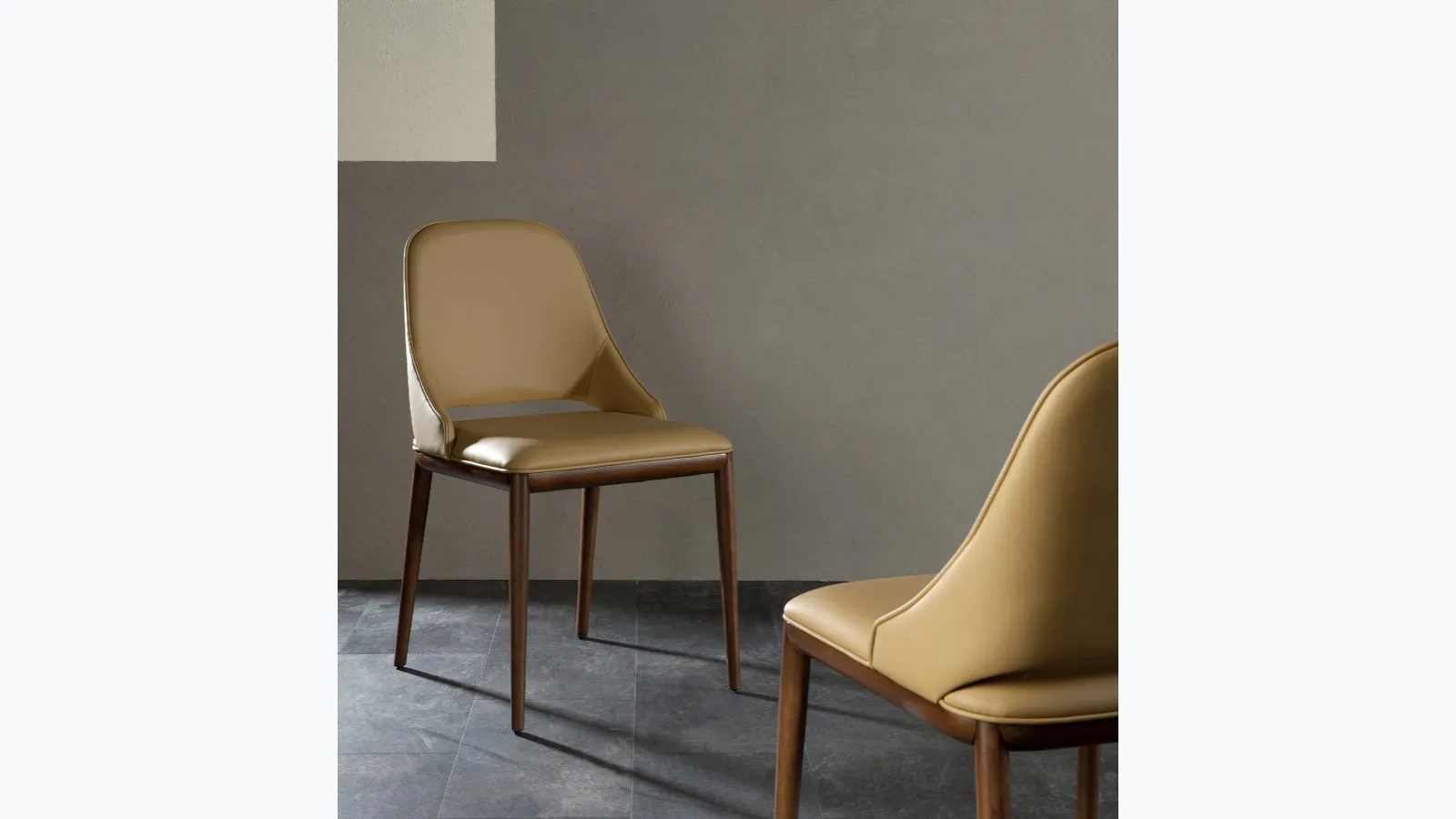 Malva chair with seat covered in leather by Tonin Casa.