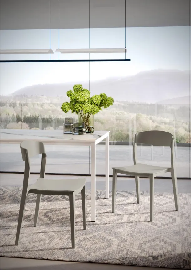 Stackable chair with integral polypropylene structure Mira by Ingenia