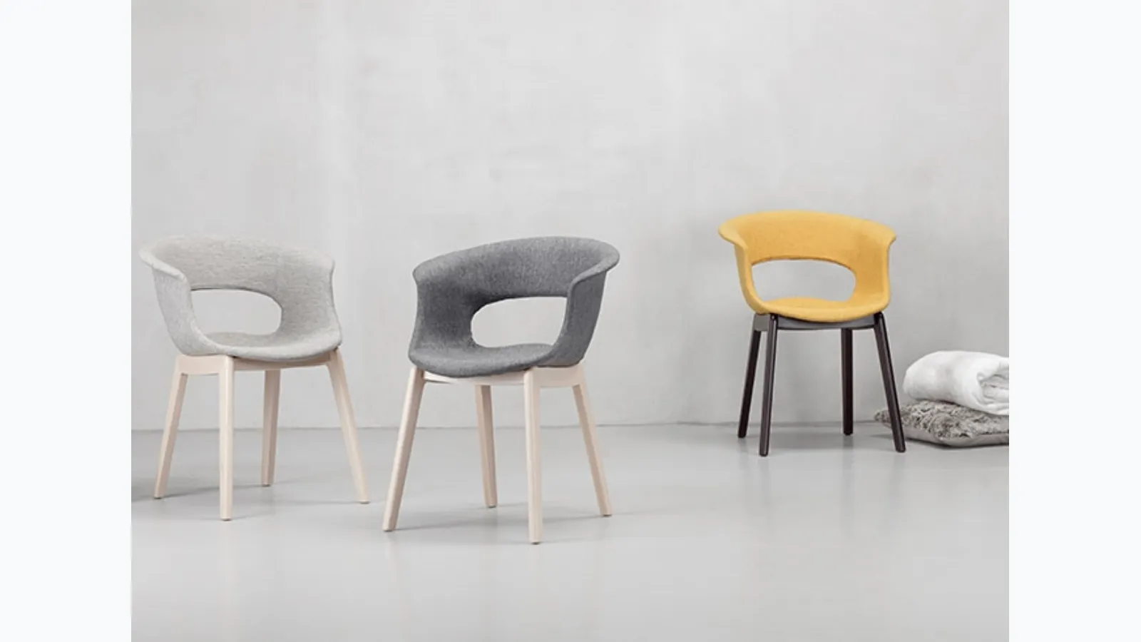 Chair Miss B with fabric seat and solid beech structure by Scab Design.