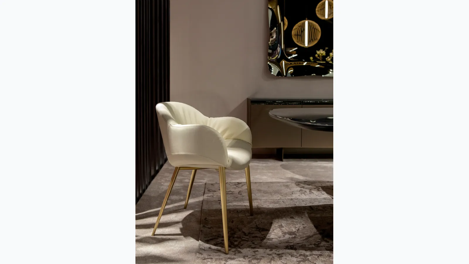 Padded leather armchair Olympia by Tonin Casa.