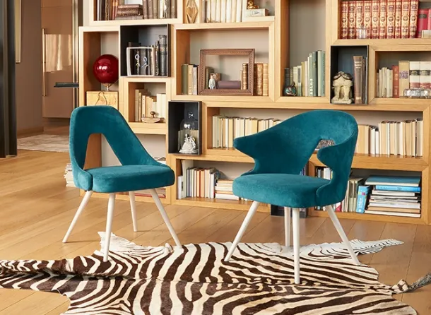 Chair with and without arms with wooden legs and upholstered fabric seat by Scab Design.