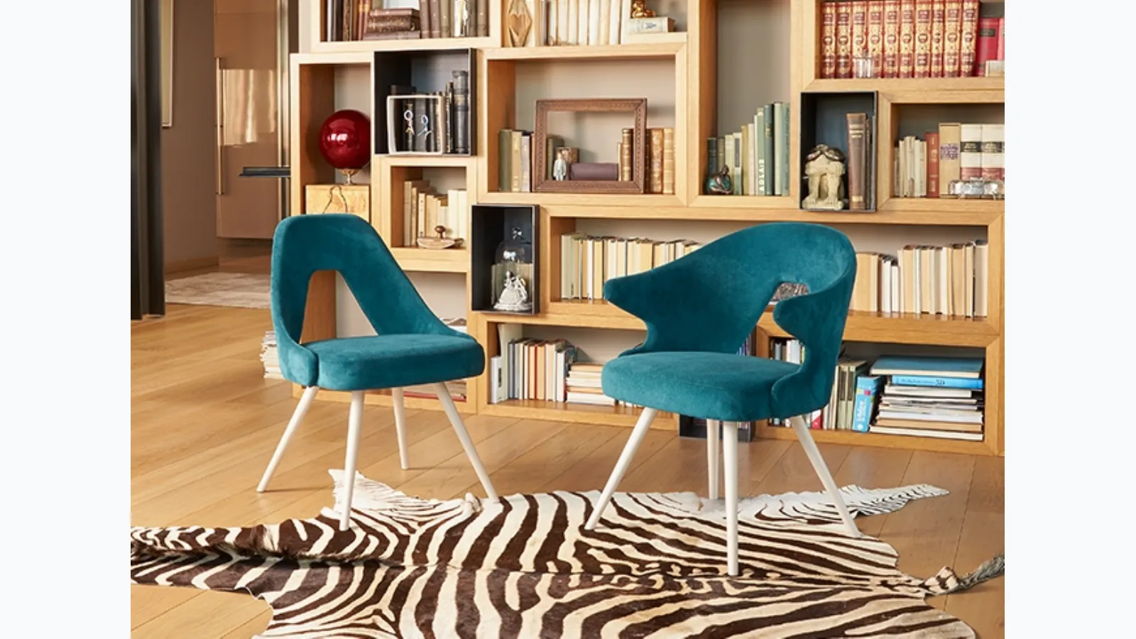 Chair with and without arms with wooden legs and upholstered fabric seat by Scab Design.