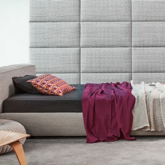 Single Reef bed in padded fabric by Flexteam.