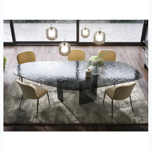 Curved and hammered glass table Ablos by Tonin Casa.