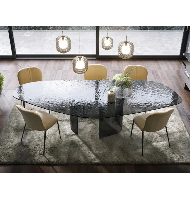 Curved and hammered glass table Ablos by Tonin Casa.