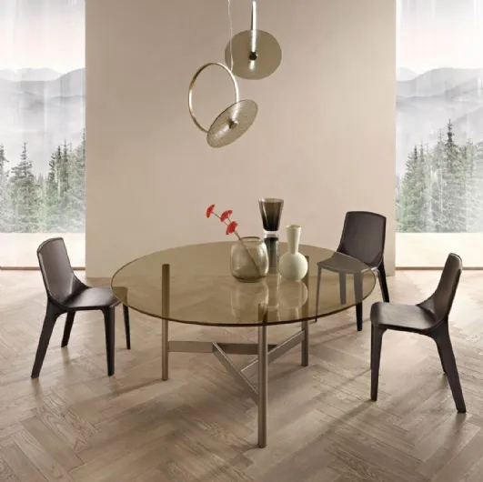 Round Agos table with glass top and metal base by Fiam.