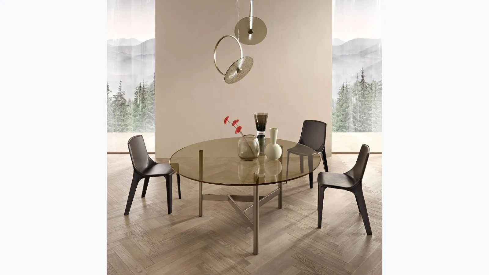 Round Agos table with glass top and metal base by Fiam.