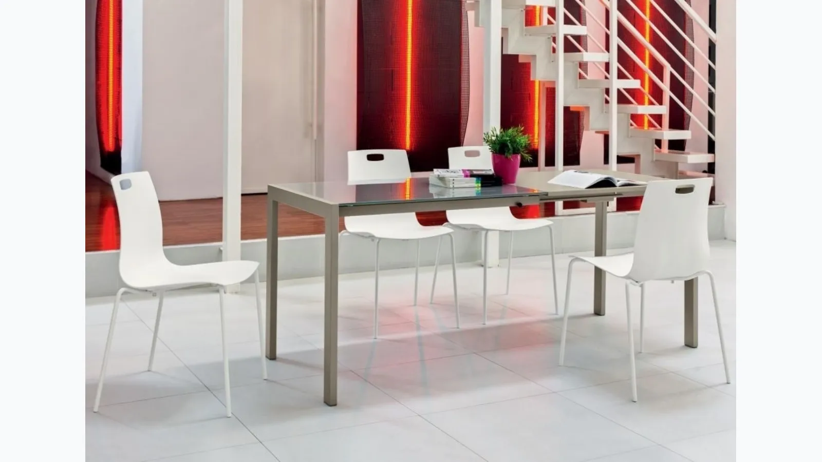 Extendable Ciak table with glossy lacquered dove grey glass top and sand lacquered steel structure by Ingenia.
