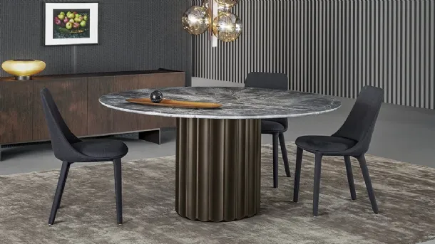 Dorian Table with marble top and polyurethane base with brushed bronze finish by Bonaldo.