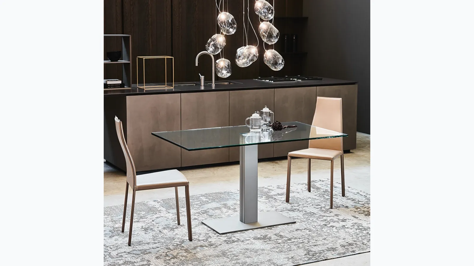Elvis table with central steel base and glass top by Cattelan Italia