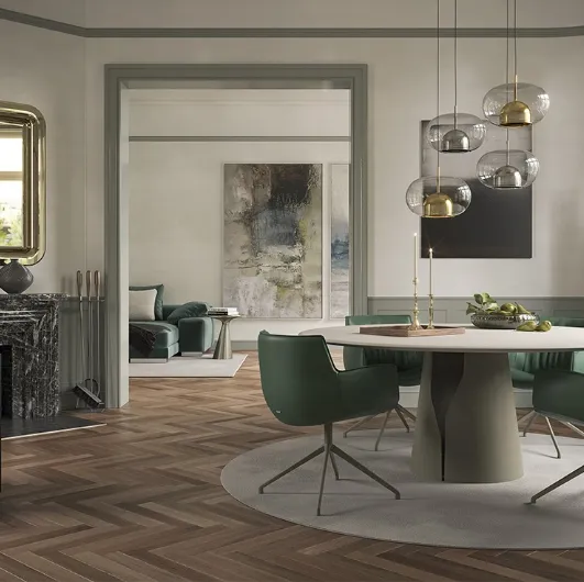 Round table with a clay-spatulated top in Giano Argile by Cattelan Italia.
