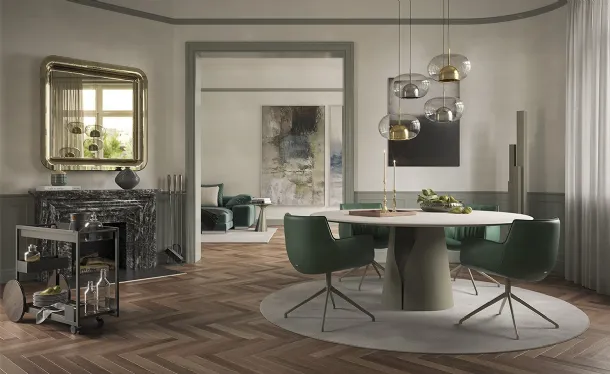 Round table with a clay-spatulated top in Giano Argile by Cattelan Italia.