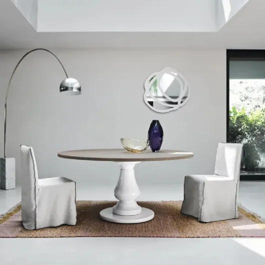 Gray 38 table with wooden top and white millgres base by Gervasoni.