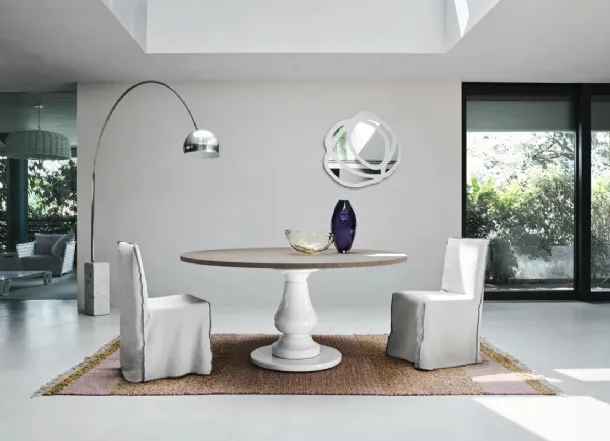 Gray 38 table with wooden top and white millgres base by Gervasoni.