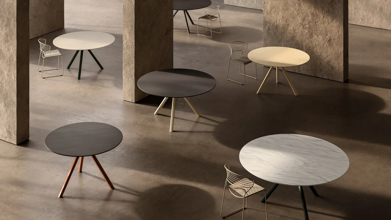 Round HEB table in wood, marble or cement by Desalto.