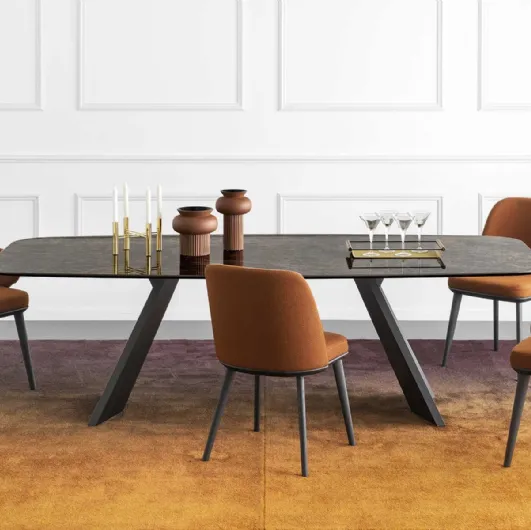 Icaro elliptical table with ceramic top and wood veneer base by Calligaris.