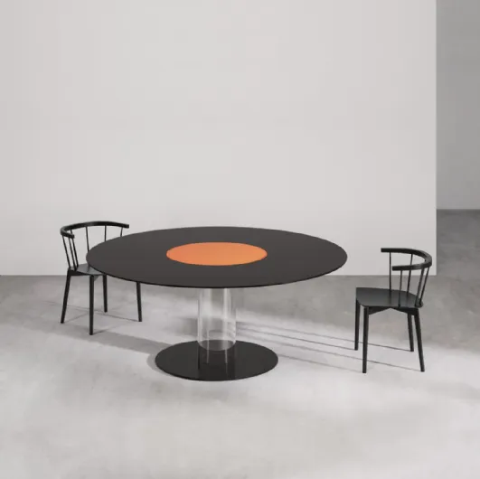 Lazy Hub table in lacquered glass with central rotating disk, serves food by Glas Italia.