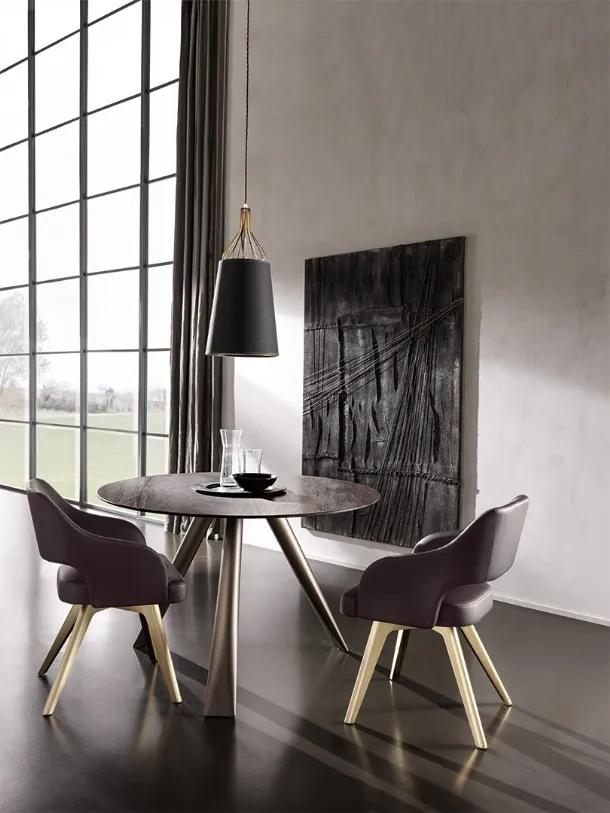 Milos round ceramic table with iron tubular legs by Cantori.
