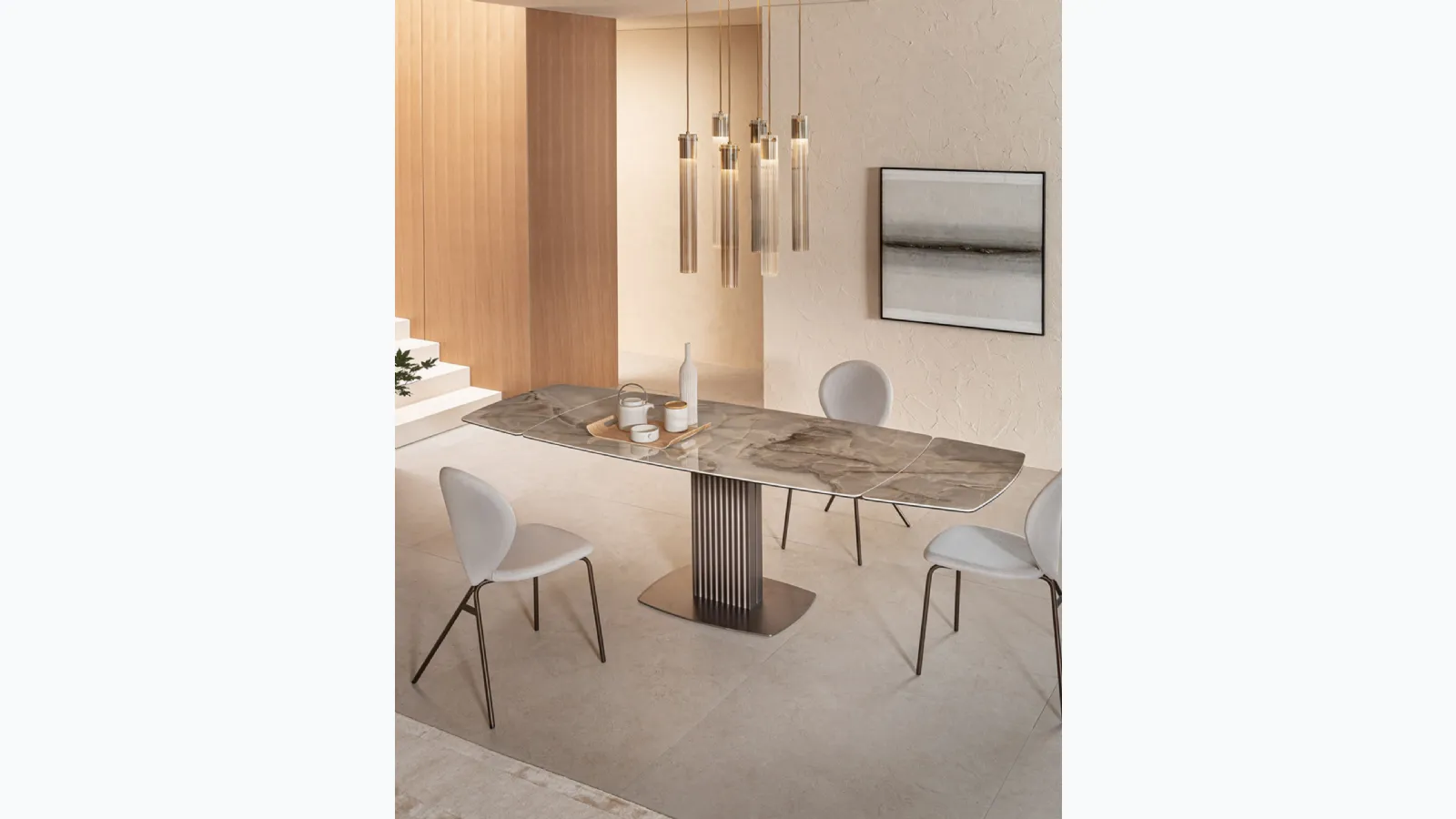 Extendable design table by Riflessi, called Wave.