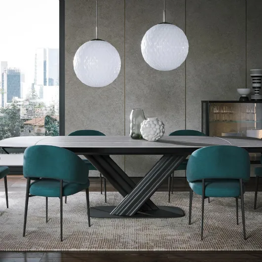 Sipario Ext travertine stoneware table by Tonin Casa.