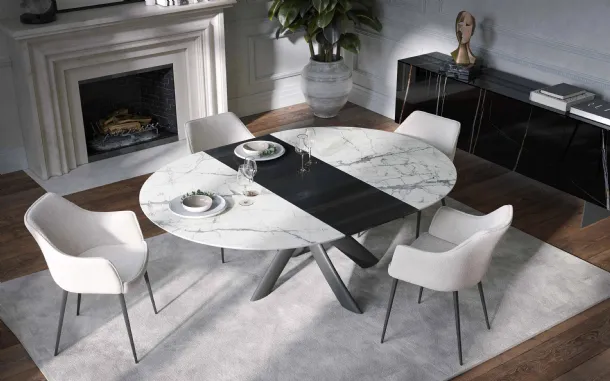 Extendable Round Style Table by Tonin Casa.